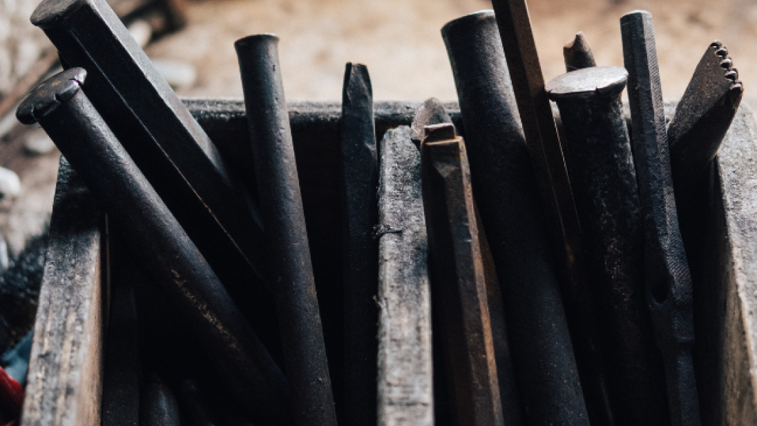 An image of a box full of chisels. 