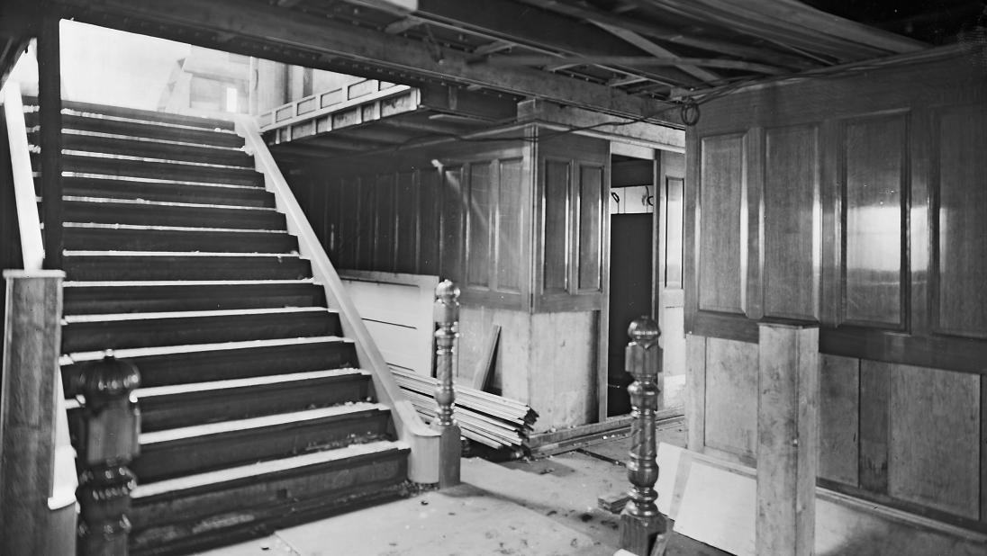 The interior of a ship during building, showing intricate joinery.