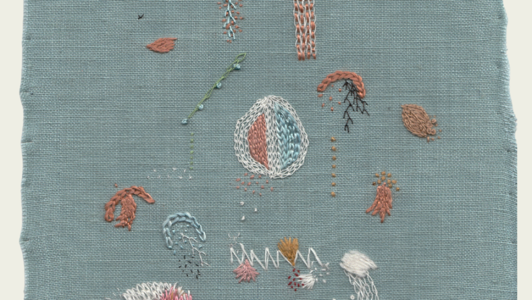 A green linen canvas is embroidered with naturally dyed thread, referencing sea creatures.