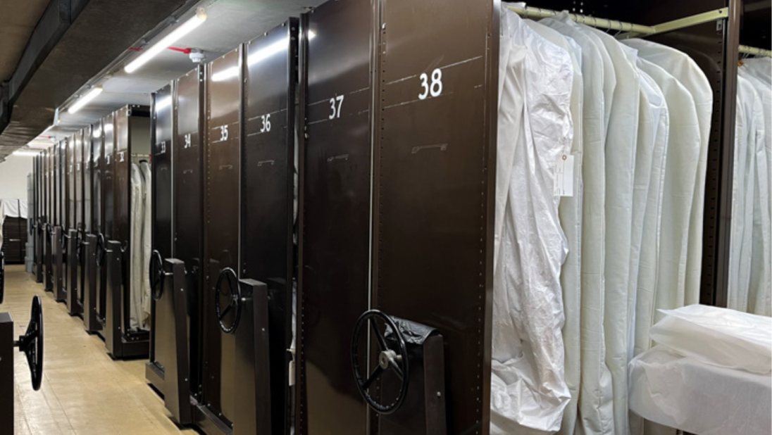 A row of brown rolling storage cabinets.