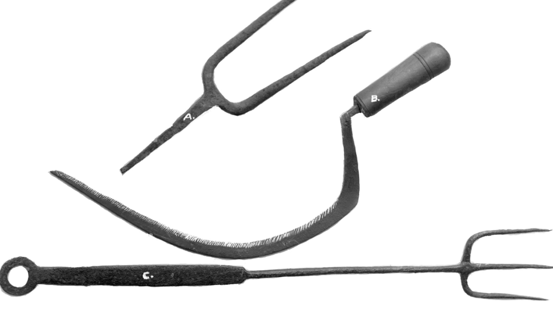 A set of tools; one two pronged metal head, one three pronged metal fork, one scythe.
