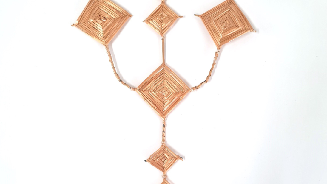A Saint Brigid's Cross. The cross is shaped like a trident, with core areas that are shaped like diamonds.