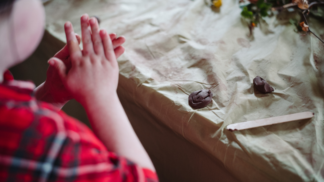 a child doing crafts at ulster folk museum