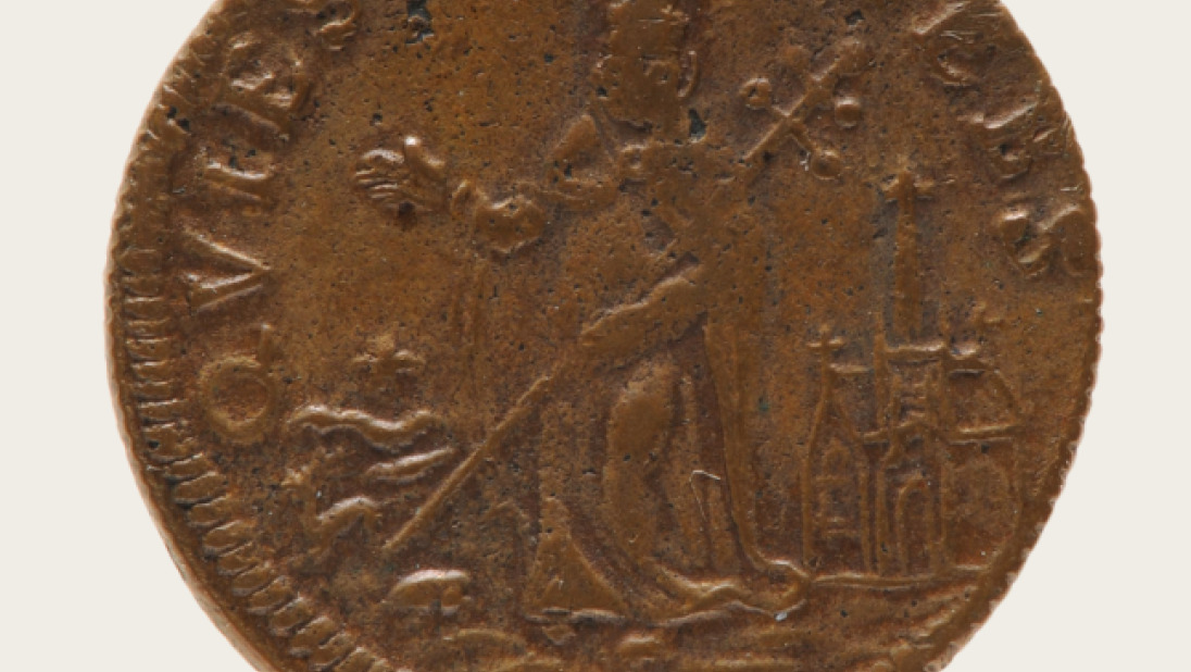 An old coin showing St. Patrick outside a church, ushering away reptiles.