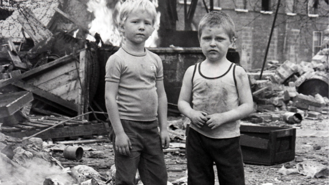 Frankie Quinn photography - black and white image of two kids in a destruction area
