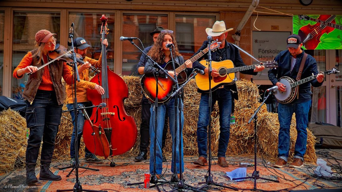 a six piece bluegrass band playing instruments 