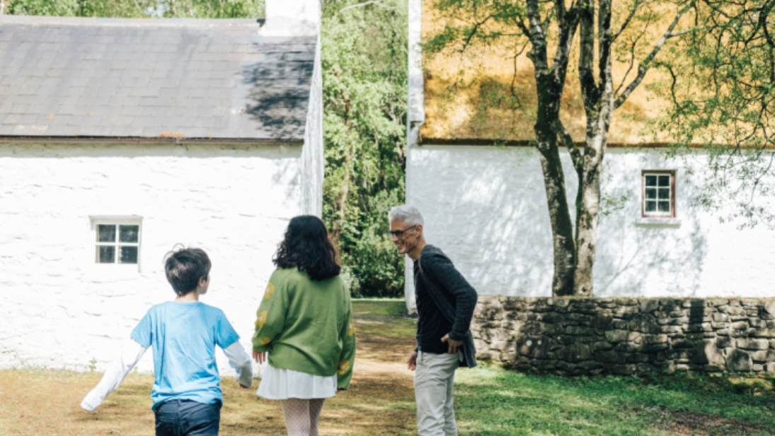 Family exploring the grounds of the Ulster American Folk Park