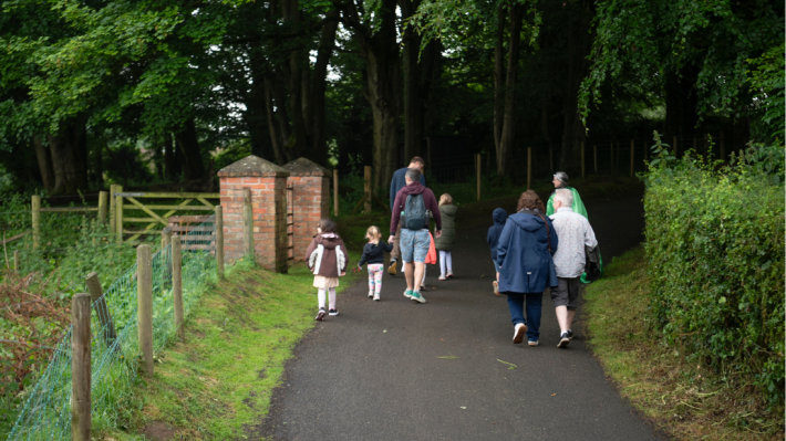 a family walking in a wooded area