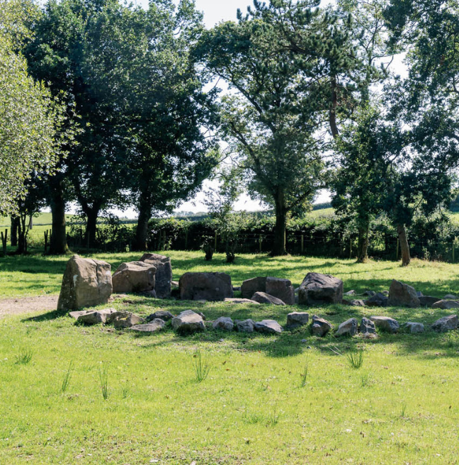 Side angle photo of the Ballintaggart Court Tomb on a sunny day