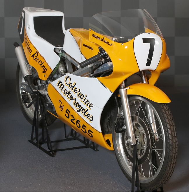 Yellow and white motorcycle with number 7 on it