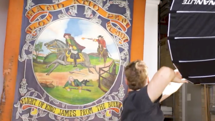 Hand and Pen Photography of Banner