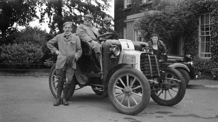Group of people standing around the MMC Car