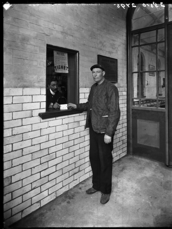 Carrick House. Interior. Poor man at kiosk, black and white photograph