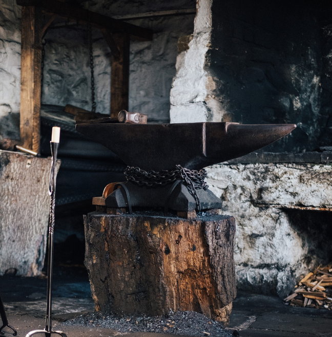 An image of an anvil in a forge.