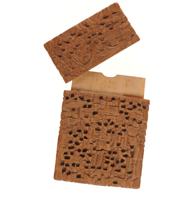 A wooden card holder, for visiting cards.