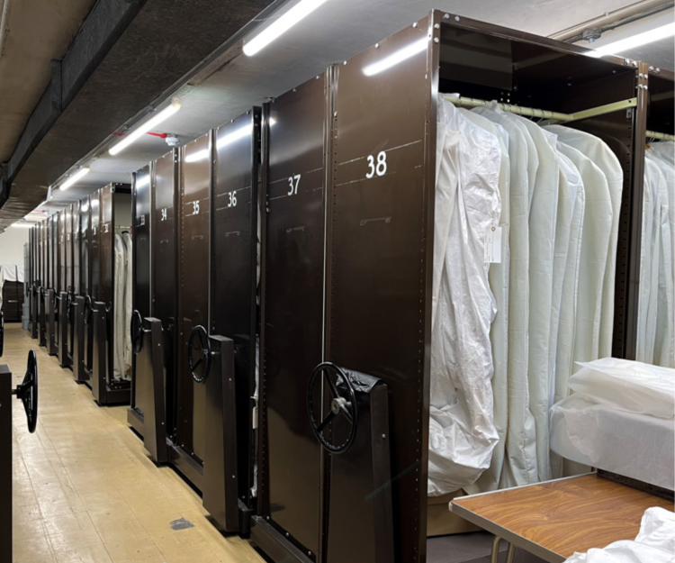 A row of brown rolling storage cabinets.