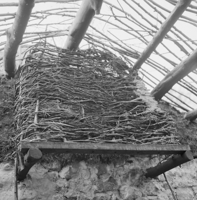 A wattled clay-covered chimney hood.