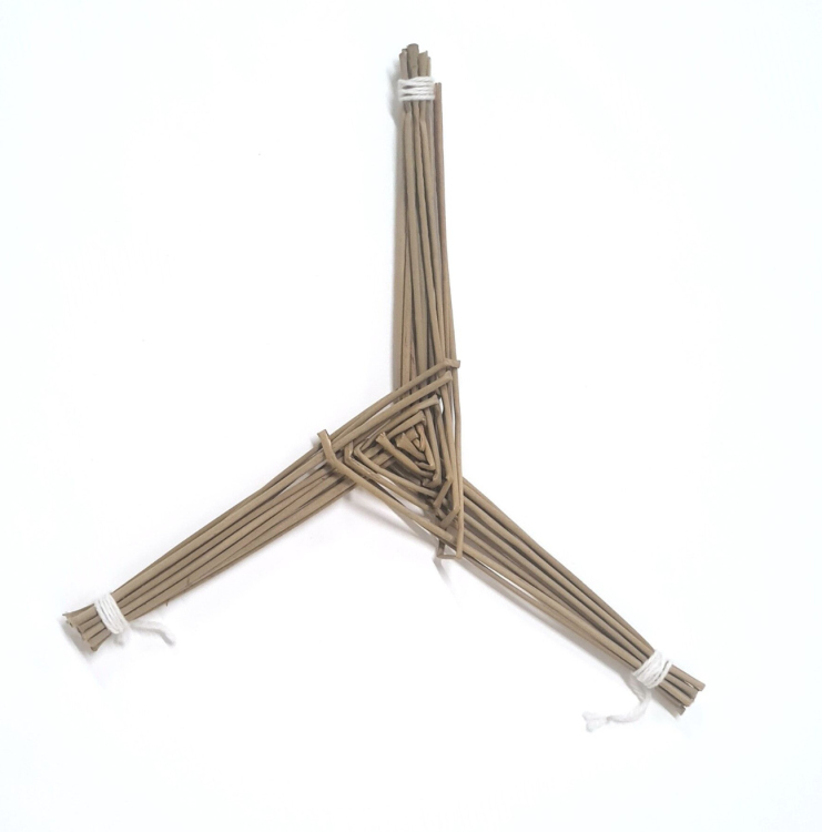A Saint Brigid's Cross. The cross is a simple three legged cross with three thick legs.