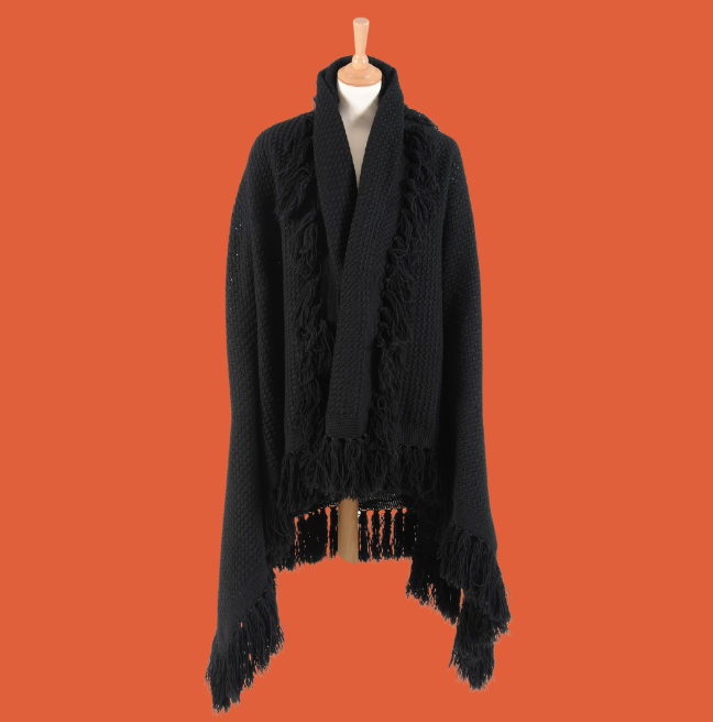 Black knitted shawl on a mannequin