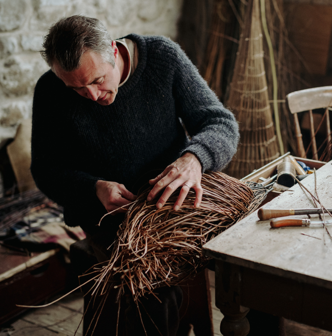 Man doing weaving at the folk museum 