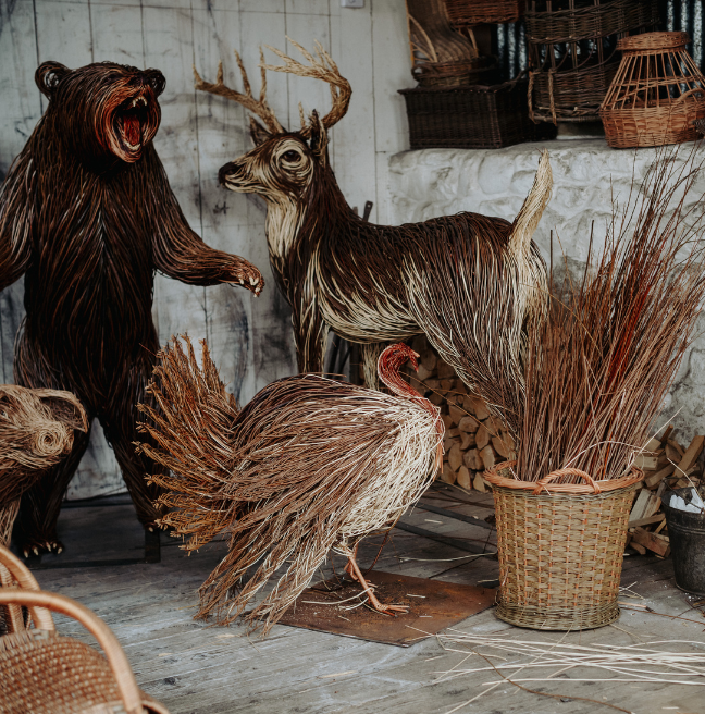 a bear, chicken and deer made out of woven willow materials