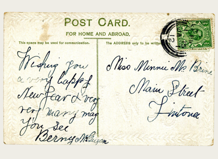 The back of a postcard with New Year's well wishes.