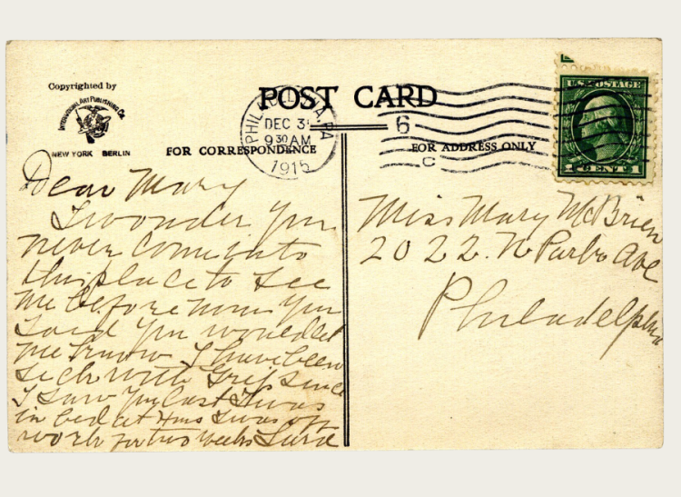 The back of a postcard with New Year's well wishes.
