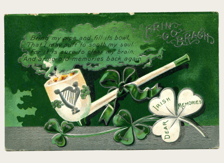 A St Patrick's day postcard with a pipe and clover decoration. 