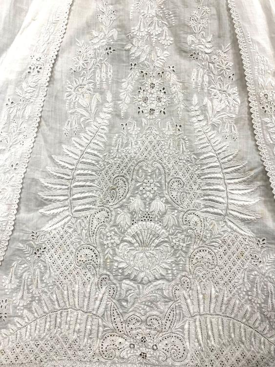 Detail on the skirt of a white christening robe from late 1800s