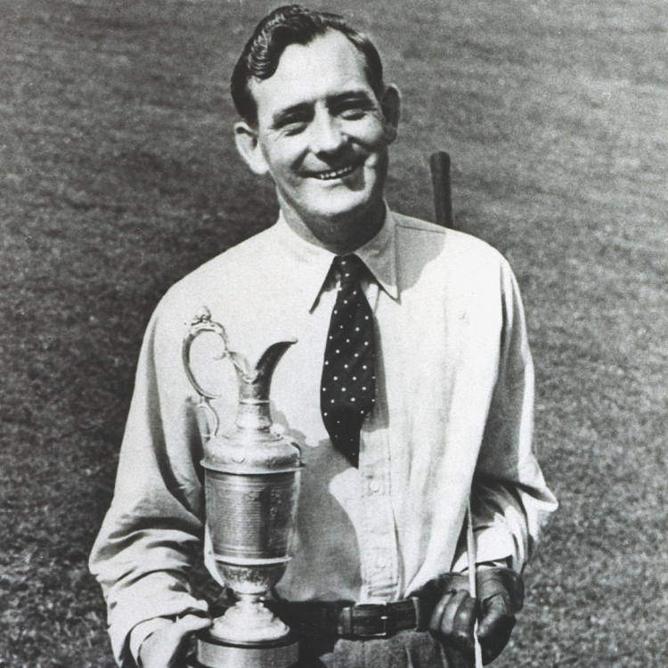 A black and white photograph of Fred Daly holding a trophy.
