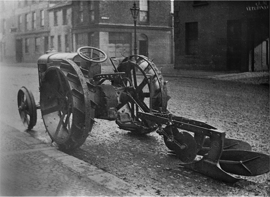 PIcture of a ferguson tractor and plough