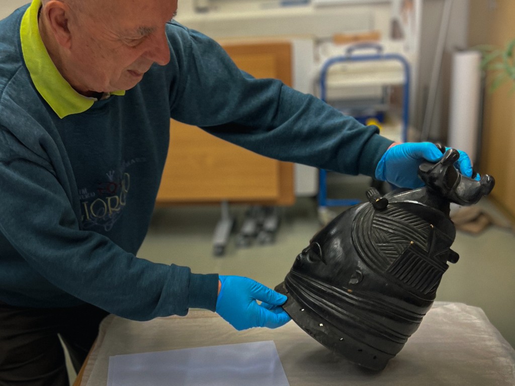 Handling the Bundu Mask at Ulster Museum