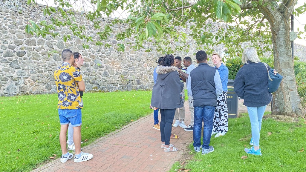 The Carrickfergus Global Voices Local Choices group touring the walled town
