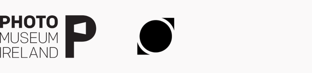 Two black and white logos - first one reads Photo Museum Ireland and second on is a circle icon with two triangle shapes top right and bottom left, which is the logo for Belfast Photo Festival